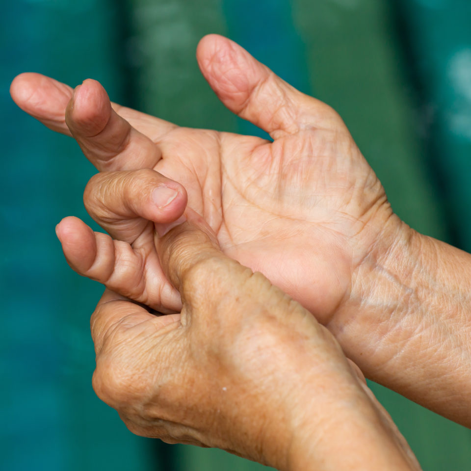 Female massaging her trigger finger