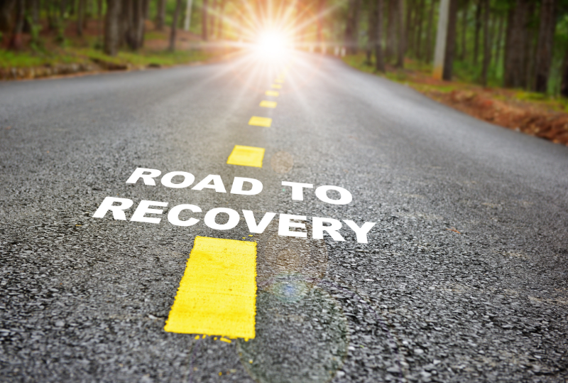 Image of a road with the words 'road to recovery'