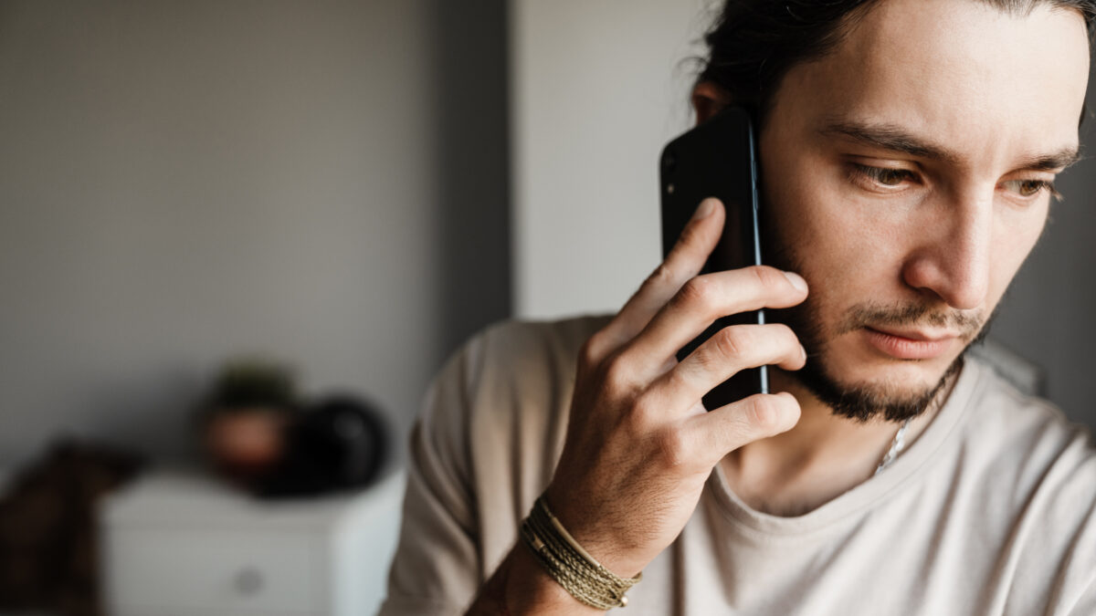 Male worker speaking with EAP on the phone