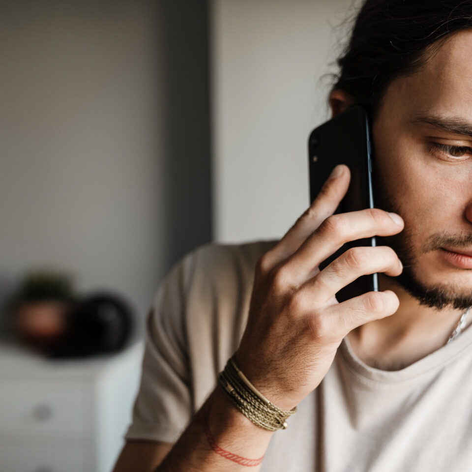 Male worker speaking with EAP on the phone